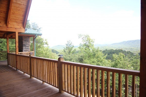 Mountain view from deck near fireplace at Four Seasons Grand, a 5 bedroom cabin rental located in Pigeon Forge