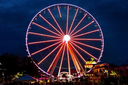 The Farris wheel at night near Four Seasons Grand, a 5 bedroom cabin rental located in Pigeon Forge