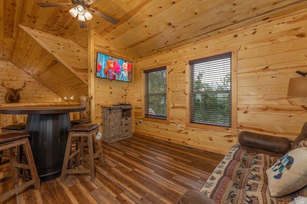 Loft with TV and seating at Pool & a View, a 2 bedroom cabin rental located in Gatlinburg