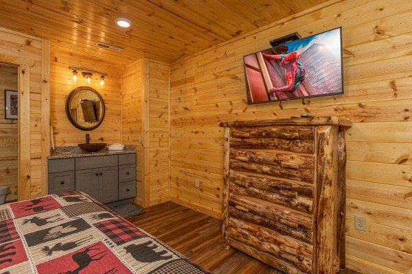 Dresser and TV in a bedroom at Pool & a View, a 2 bedroom cabin rental located in Gatlinburg