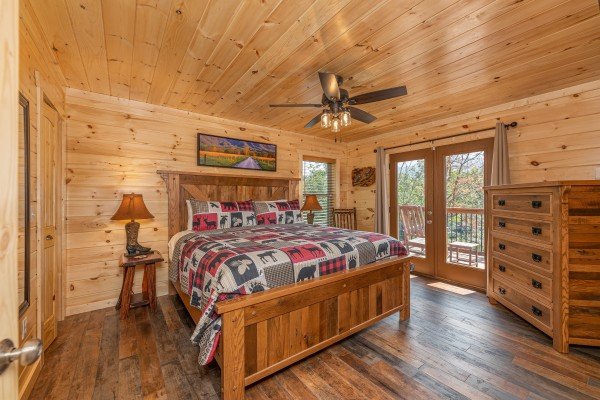 Bedroom with deck entry at Twin Peaks, a 5 bedroom cabin rental located in Gatlinburg