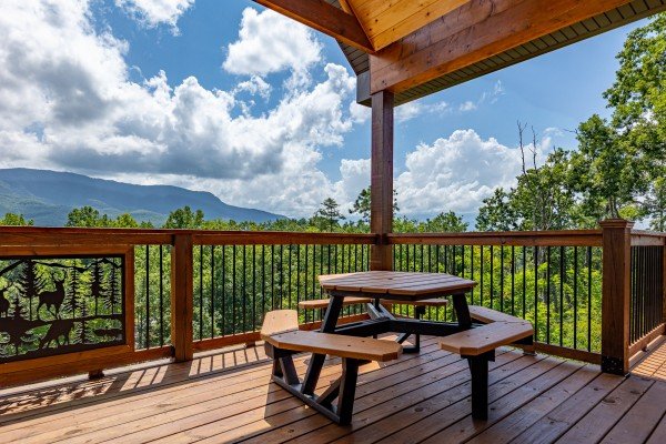 Deck dining area at Twin Peaks, a 5 bedroom cabin rental located in Gatlinburg