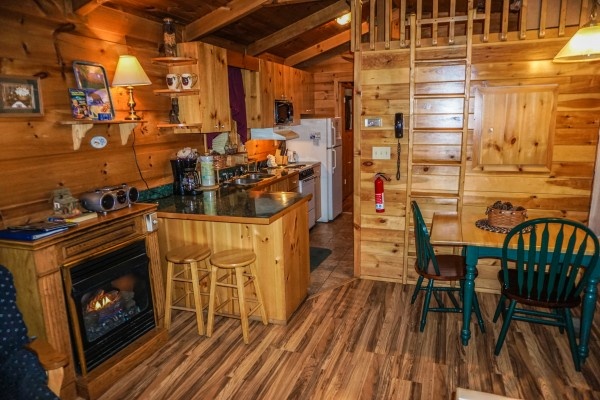 Kitchen and dining area at Cozy Cabin, a 2-bedroom cabin rental located in Gatlinburg