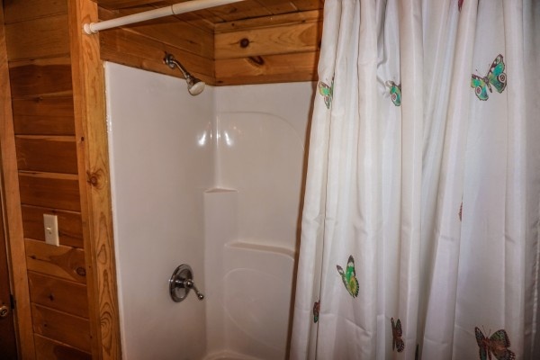Bathroom shower at Cozy Cabin, a 2-bedroom cabin rental located in Gatlinburg