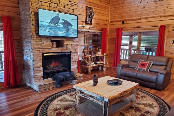 Fireplace and living room seating at Bears Don't Bluff, a 3 bedroom cabin rental located in Pigeon Forge