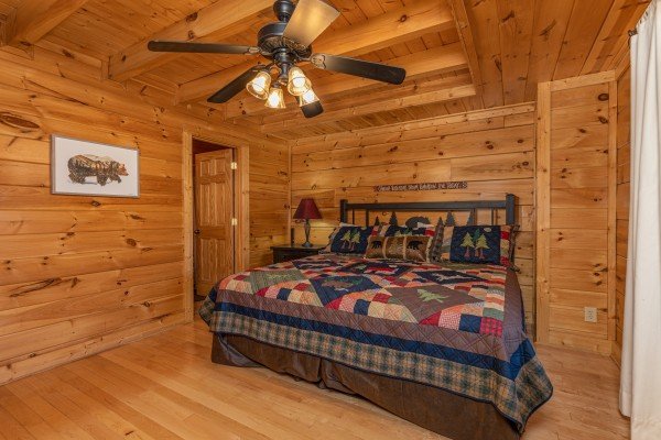 King bed, night stand, and lamp at Bears Don't Bluff, a 3 bedroom cabin rental located in Pigeon Forge