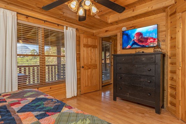 Dresser and TV in a bedroom at Bears Don't Bluff, a 3 bedroom cabin rental located in Pigeon Forge