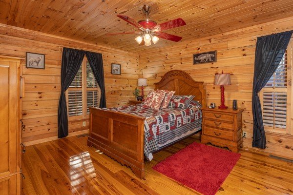 Bedroom with night stands and lamps at Wilderness Adventure, a 2 bedroom cabin rental in Pigeon Forge
