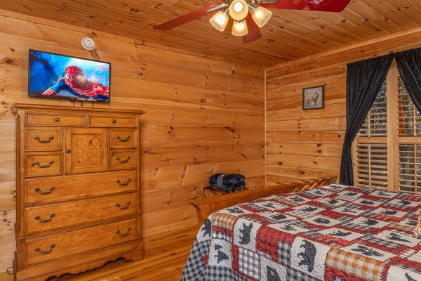 Dresser and TV in a bedroom at Wilderness Adventure, a 2 bedroom cabin rental in Pigeon Forge