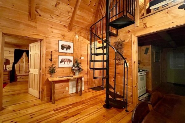 Spiral staircase to the loft at Wilderness Adventure, a 2 bedroom cabin rental in Pigeon Forge