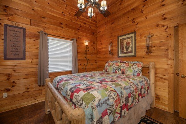 Bedroom with a log bed at Southern Charm, a 2 bedroom cabin rental located in Pigeon Forge