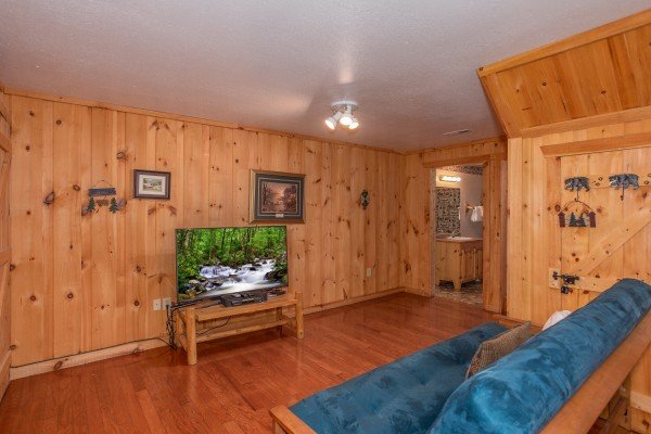 Television in the game room at Bearly in the Mountains, a 5-bedroom cabin rental located in Pigeon Forge
