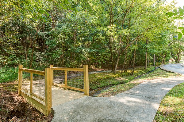 a paved walking trail at alpine something blue a 1 bedroom cabin rental located in pigeon forge