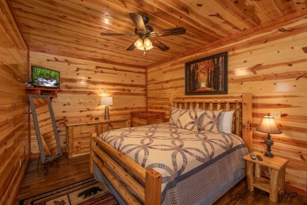 Bedroom with a TV at The Pool Palace, a 5 bedroom cabin rental located in Pigeon Forge