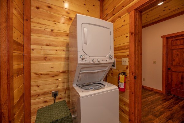 Stacked washer and dryer at The Pool Palace, a 5 bedroom cabin rental located in Pigeon Forge