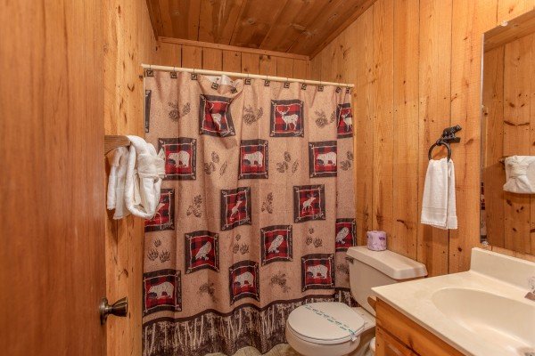 Bathroom with a tub and shower at Peace & Quiet, a 3 bedroom cabin rental located in Pigeon Forge