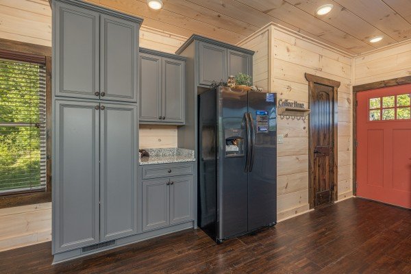 Fridge and cabinets at Smoky Mountain Chalet, a 3 bedroom cabin rental located in Pigeon Forge