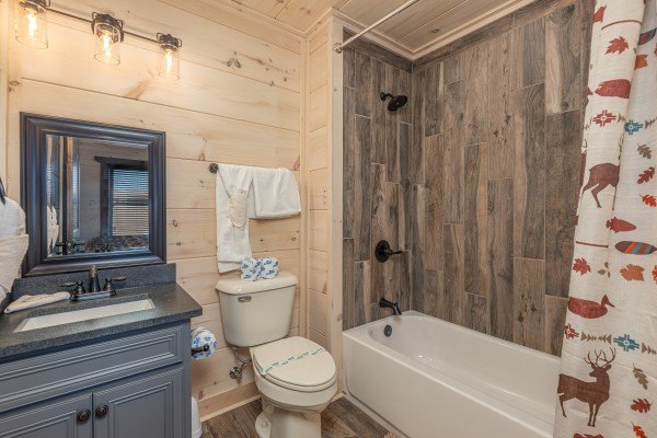 Bathroom with a tub and shower at Smoky Mountain Chalet, a 3 bedroom cabin rental located in Pigeon Forge