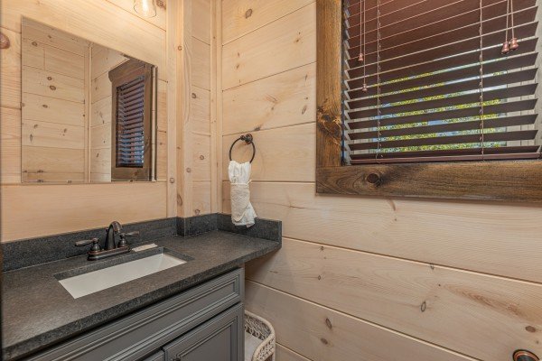 Half bath at Smoky Mountain Chalet, a 3 bedroom cabin rental located in Pigeon Forge