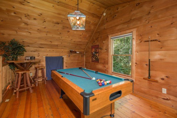 Pool table in the loft at Denim Blues, a 1-bedroom cabin rental located in Gatlinburg