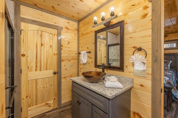 Vanity with a custom sink at Everly's Splash, a 4 bedroom cabin rental located in Pigeon Forge