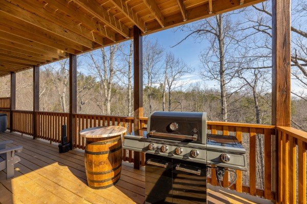 Grill on the covered deck at Everly's Splash, a 4 bedroom cabin rental located in Pigeon Forge