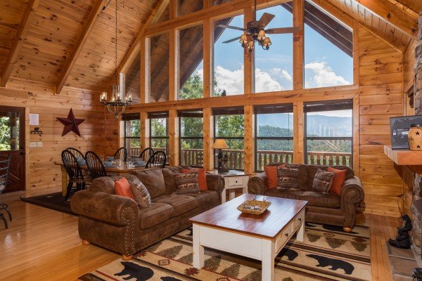 Living room with love seat, sofa, and mountain views at Endless View, a 4 bedroom cabin rental located in Pigeon Forge
