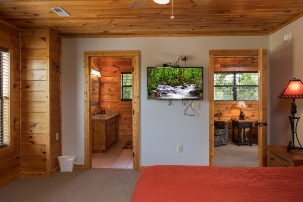 TV and en suite bath at Endless View, a 4 bedroom cabin rental located in Pigeon Forge