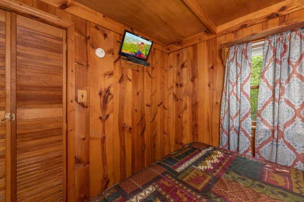TV in a bedroom at Heavenly Hideaway, a 2-bedroom cabin rental located in Gatlinburg