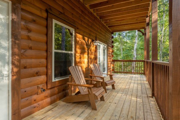 Adirondack chairs on a deck at Gar Bear's Hideaway, a Pigeon Forge cabin rental