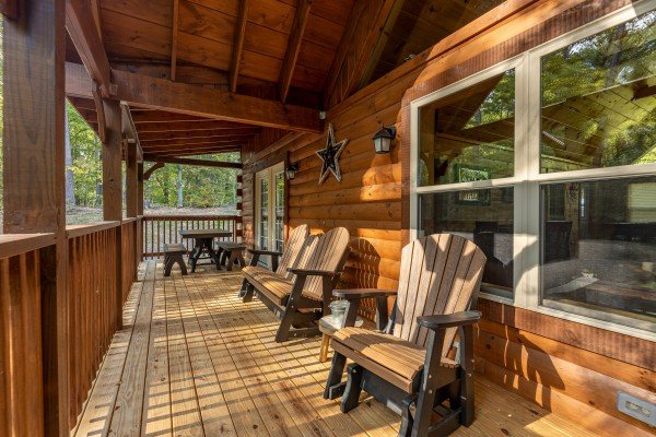 Deck with picnic table and chairs at Gar Bear's Hideaway, a Pigeon Forge cabin rental