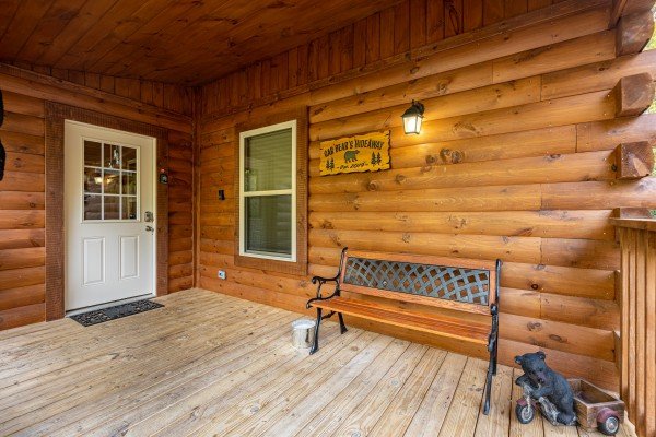 Front porch with bench at Gar Bear's Hideaway, a Pigeon Forge cabin rental