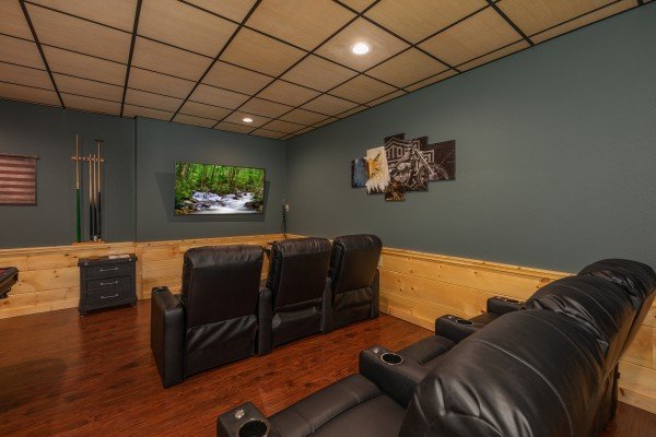 Theater room with large TV at Gar Bear's Hideaway, a 3 bedroom cabin rental located in Pigeon Forge