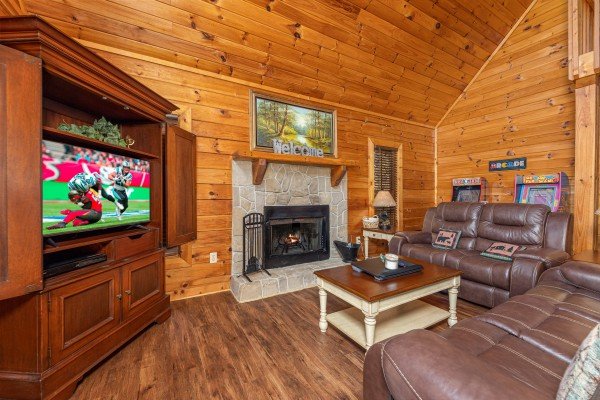 Living room with fireplace and TV at Lakeview Point, a 2 bedroom cabin rental located in Douglas Lake