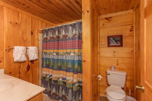 Bathroom with a tub and shower at Wonders in the Sky, a 3 bedroom cabin rental located in Gatlinburg