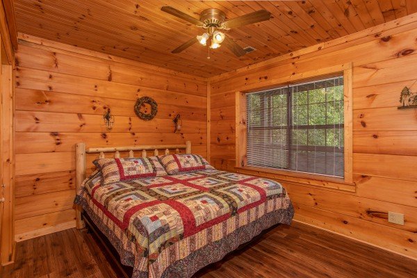 Bedroom with a king bed at Wonders in the Sky, a 3 bedroom cabin rental located in Gatlinburg