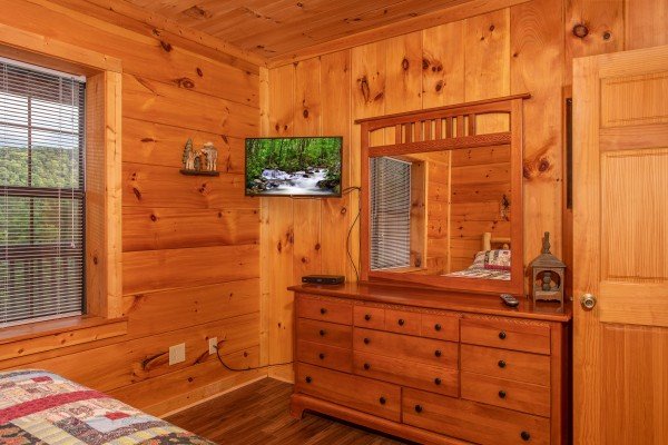 Bedroom with a dresser and TV at Wonders in the Sky, a 3 bedroom cabin rental located in Gatlinburg