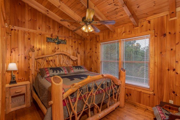Log bed at Wonders in the Sky, a 3 bedroom cabin rental located in Gatlinburg
