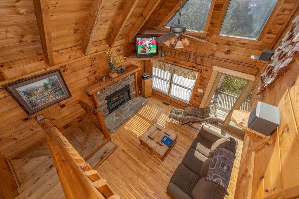 Looking down at the living room at American Beauty, a 2 bedroom cabin rental located in Pigeon Forge