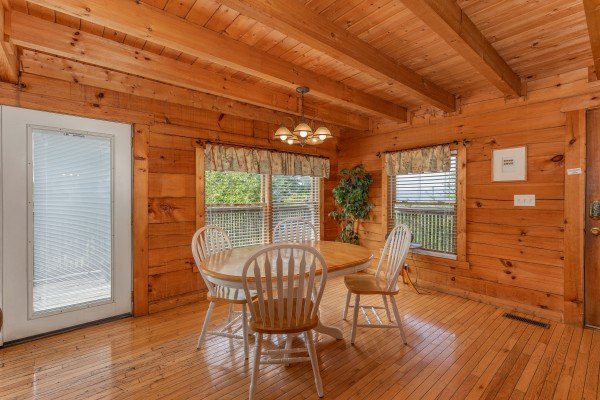 Dining table for four at American Beauty, a 2 bedroom cabin rental located in Pigeon Forge