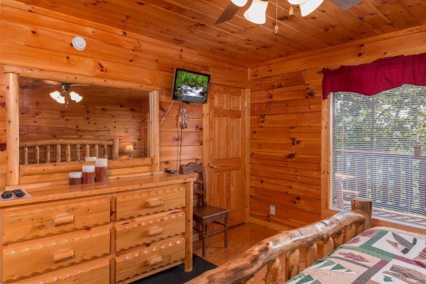 Dresser and TV in a bedroom at A Beautiful Memory, a 4 bedroom cabin rental located in Pigeon Forge