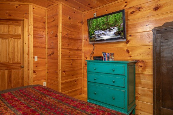 Dresser and a TV in a bedroom at Firefly Ridge, a 2 bedroom cabin rental located in Pigeon Forge