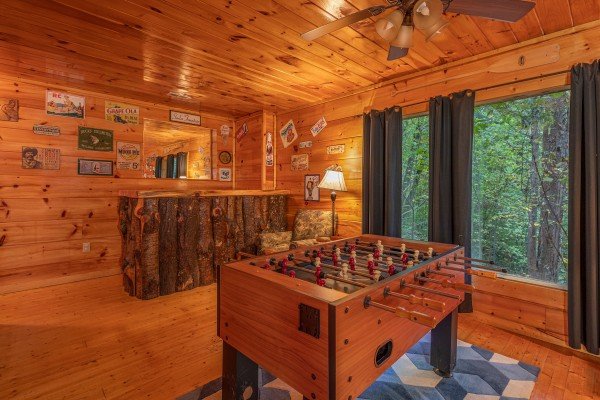 Foosball table and bar in the gameroom at Firefly Ridge, a 2 bedroom cabin rental located in Pigeon Forge