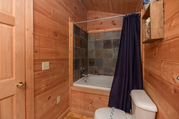 Bathroom with a shower and tub at My Blue Heaven, a 1 bedroom cabin rental located in Gatlinburg