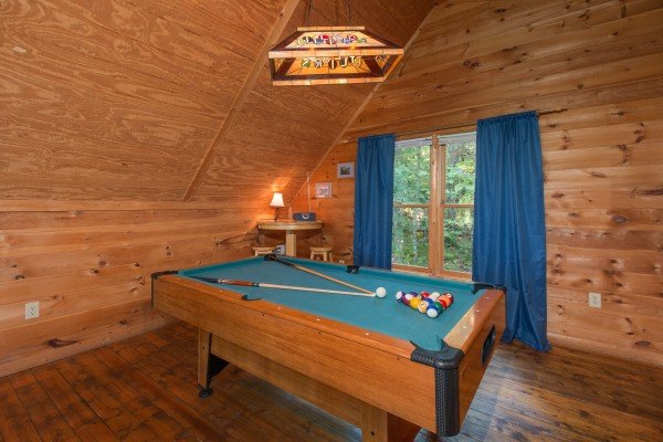 Pool table in the loft at My Blue Heaven, a 1 bedroom cabin rental located in Gatlinburg