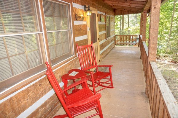 Rocking chairs on the covered porch at Little Bear, a 1 bedroom cabin rental located in Pigeon Forge