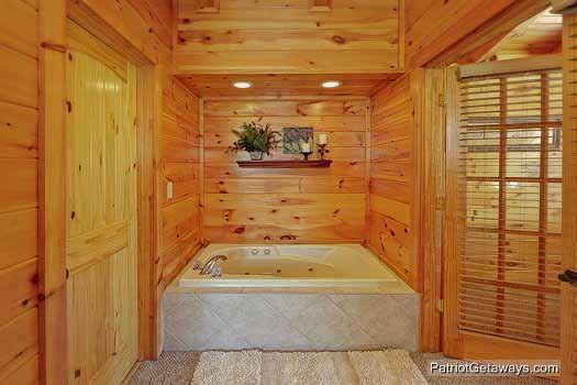 Jacuzzi tub in third floor bedroom at Logged Out, a 3 bedroom cabin rental located in Pigeon Forge