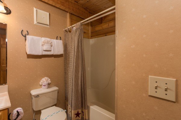 Bathroom at Hooked on Cowboys Lodge, a 2 bedroom cabin rental located in Pigeon Forge