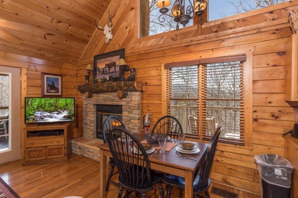 Dining table for 4 at Hooked on Cowboys Lodge, a 2 bedroom cabin rental located in Pigeon Forge
