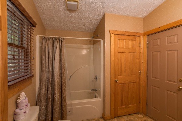 Main bathroom at Hooked on Cowboys Lodge, a 2 bedroom cabin rental located in Pigeon Forge